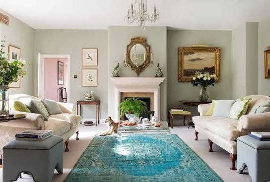 Traditional living room with sage walls and fireplace